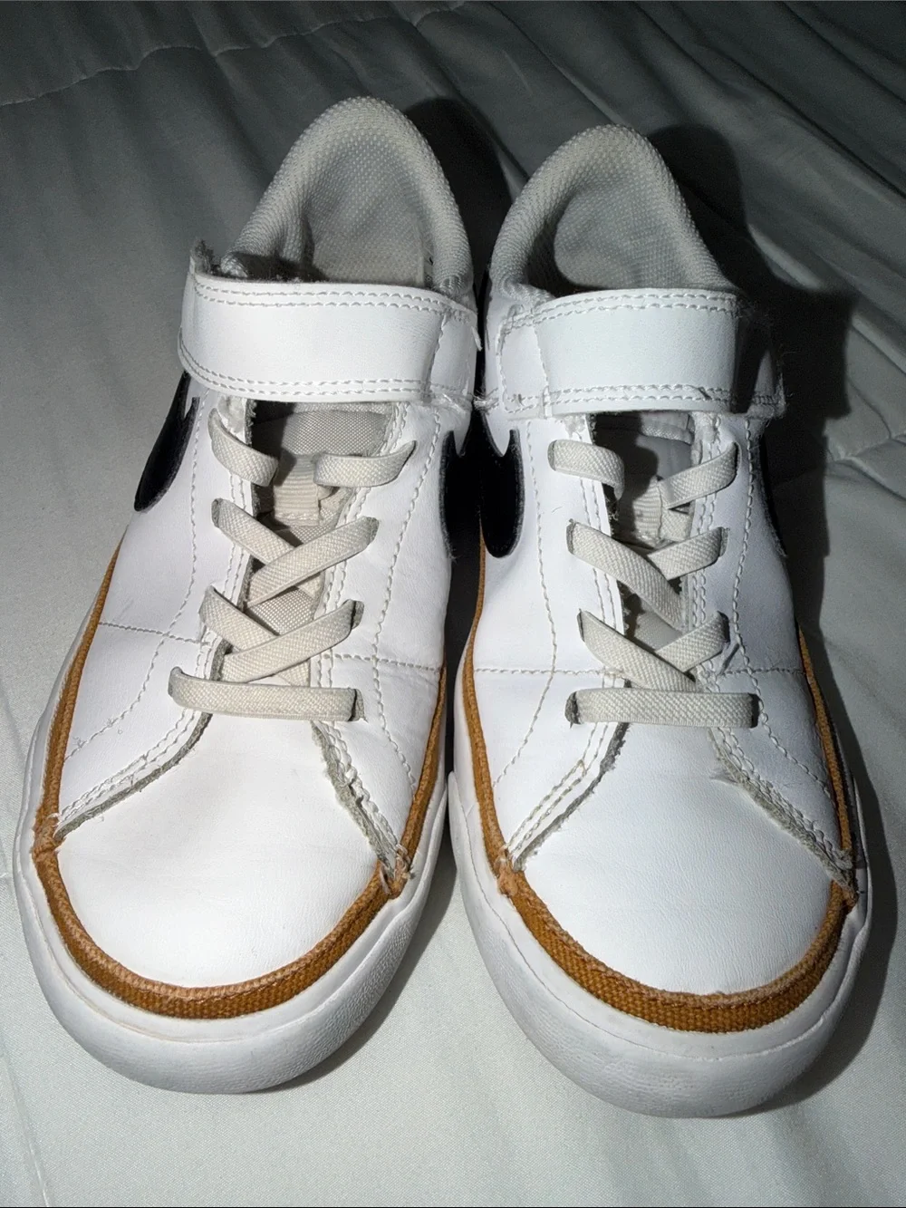 Nike White Kids Sneakers with Black Swoosh and Brown Trim